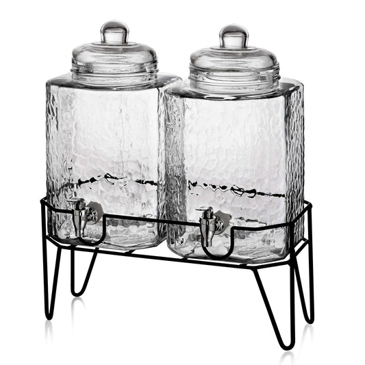 Two square textured glass beverage dispensers with silver spigots on a black metal wire stand.