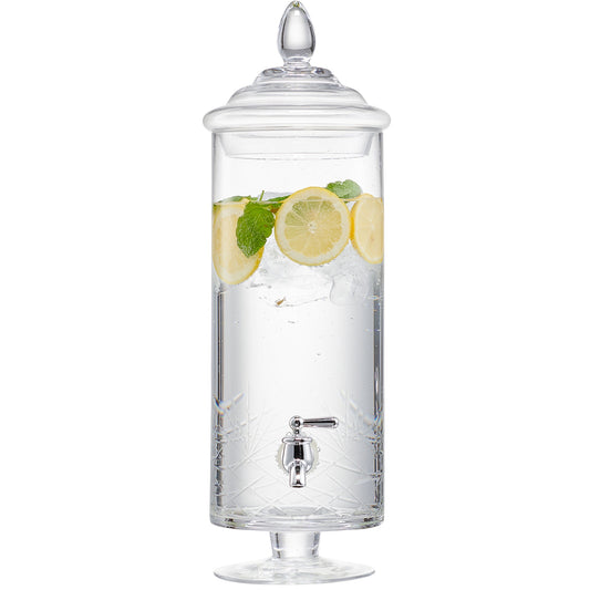 Tall cylindrical glass beverage dispenser with a metal spigot, lid, and lemon slices inside.