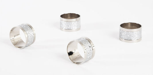 Four silver-toned napkin rings with textured glittery white bands, arranged on a clean white background.