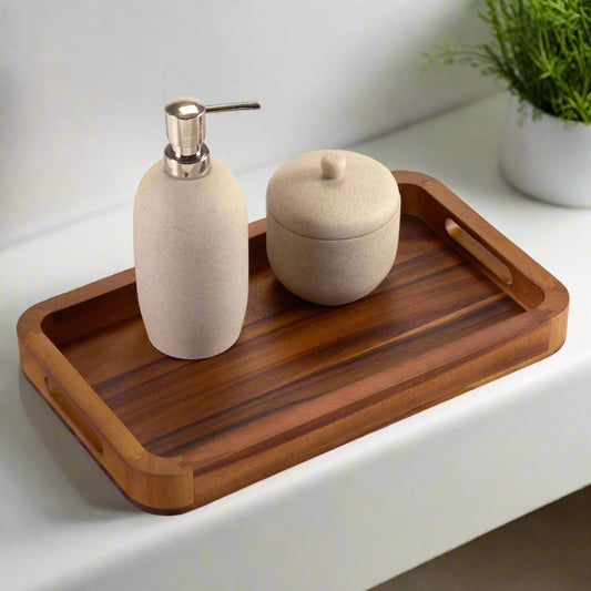 A wooden tray with decorative containers sitting on a white table.
