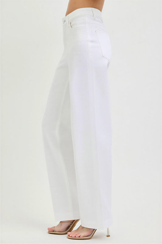 White jeans worn by a person on a white background
