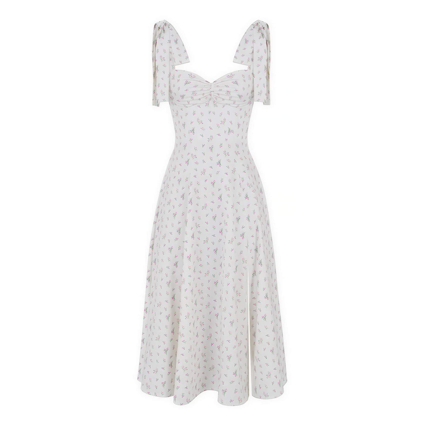 Chic French resort dress in white with pastel floral patterns and tie straps, featuring a fitted bodice and flared skirt.