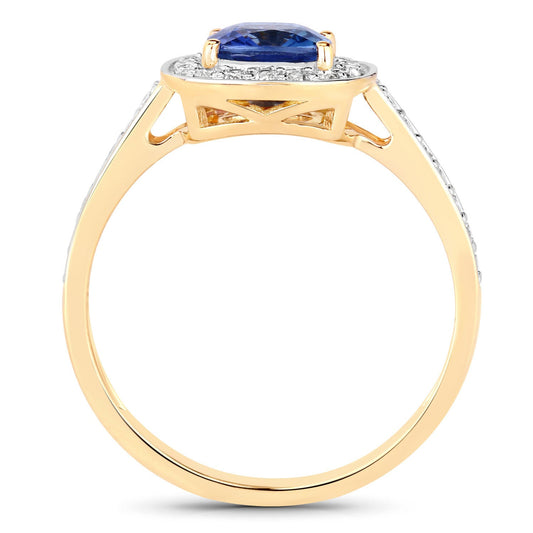 Genuine blue sapphire and white diamond ring in 18K yellow gold, featuring a 1.31 carat sapphire and intricate band design.