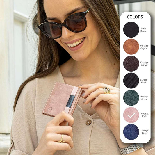 Woman holding a pink leather Marseille Mirror Wallet by TRU VIRTU with a color selection menu showing seven options.