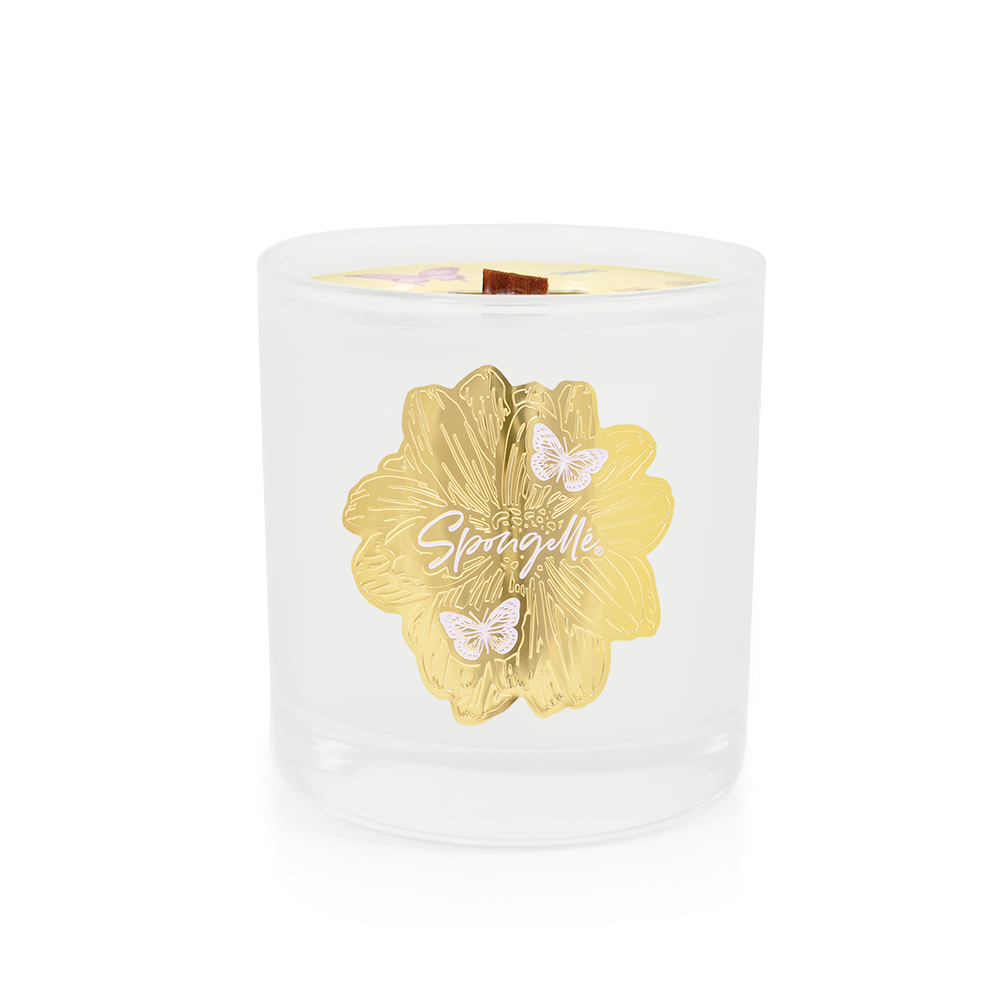 White glass candle with a gold floral design and butterflies, labeled "Petitgrain | Botanica Candle.