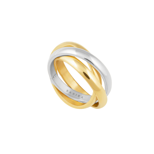 Three interlocking metal bands in gold and silver colors with SAHIRA engraved on the inner silver band.