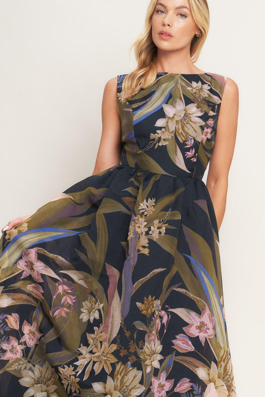 Woman wearing a floral dress with a white background