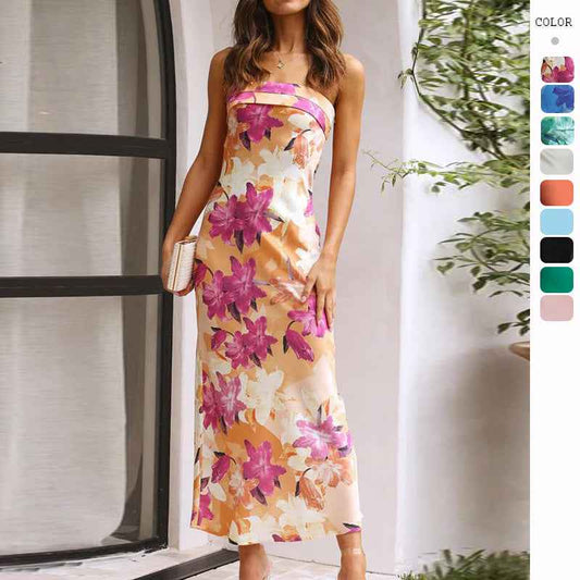 Satin strapless backless midi dress with a floral pattern in pink and orange, featuring a side slit and fitted silhouette.