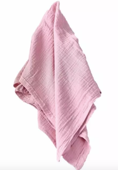 Pink textured fabric on a white background