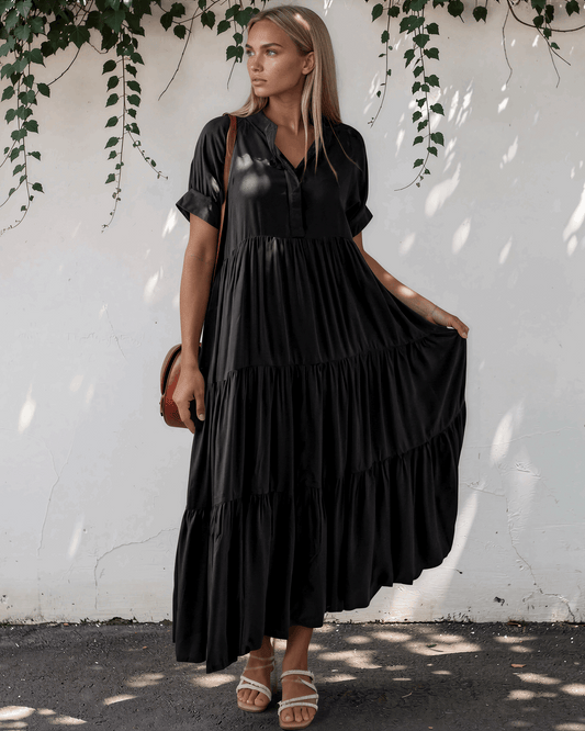 Model wearing a short sleeve tiered maxi dress