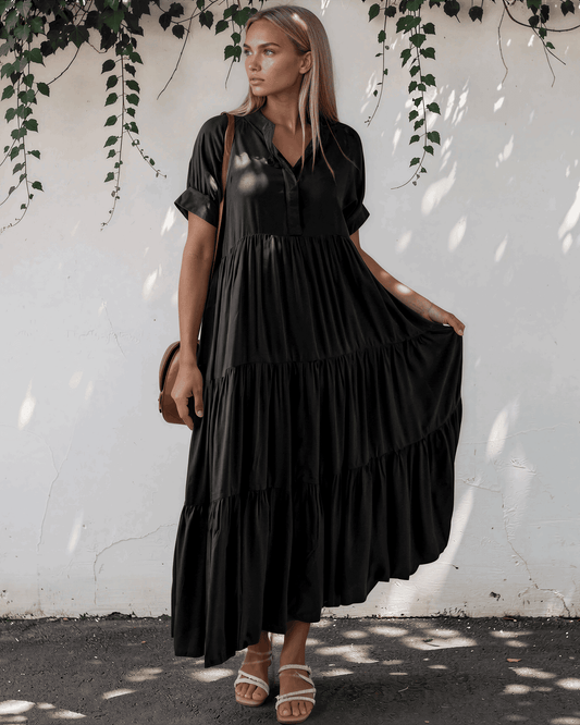 Model wearing a short sleeve tiered maxi dress