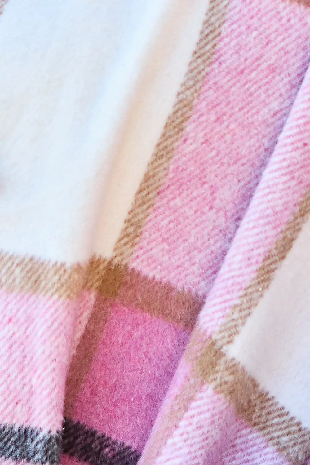 Close-up of a pink and brown checkered fabric texture