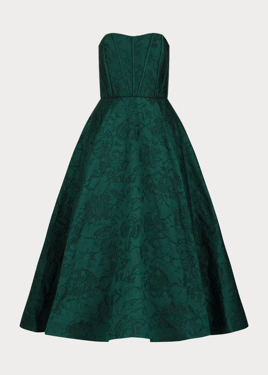 Green strapless dress with floral pattern on a light gray background