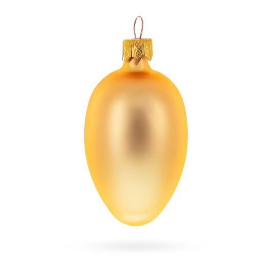 Single rose gold egg-shaped glass ornament with a matte finish and a gold metal cap and wire loop.
