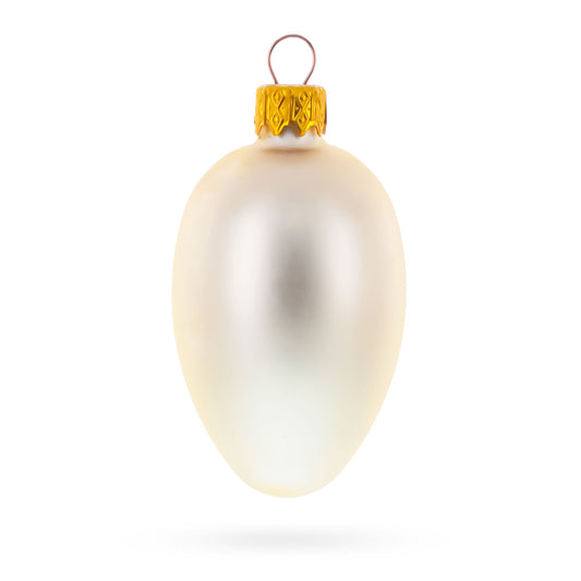 Single champagne glass egg ornament with a matte finish and a gold metal cap and hanging loop.