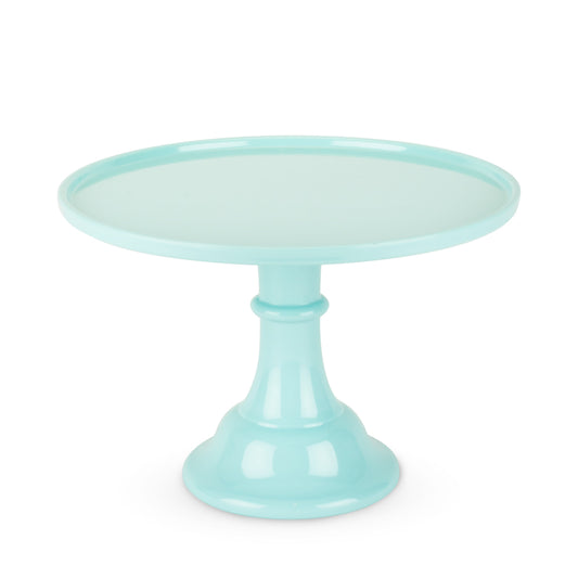 Mint green cake stand on a white background