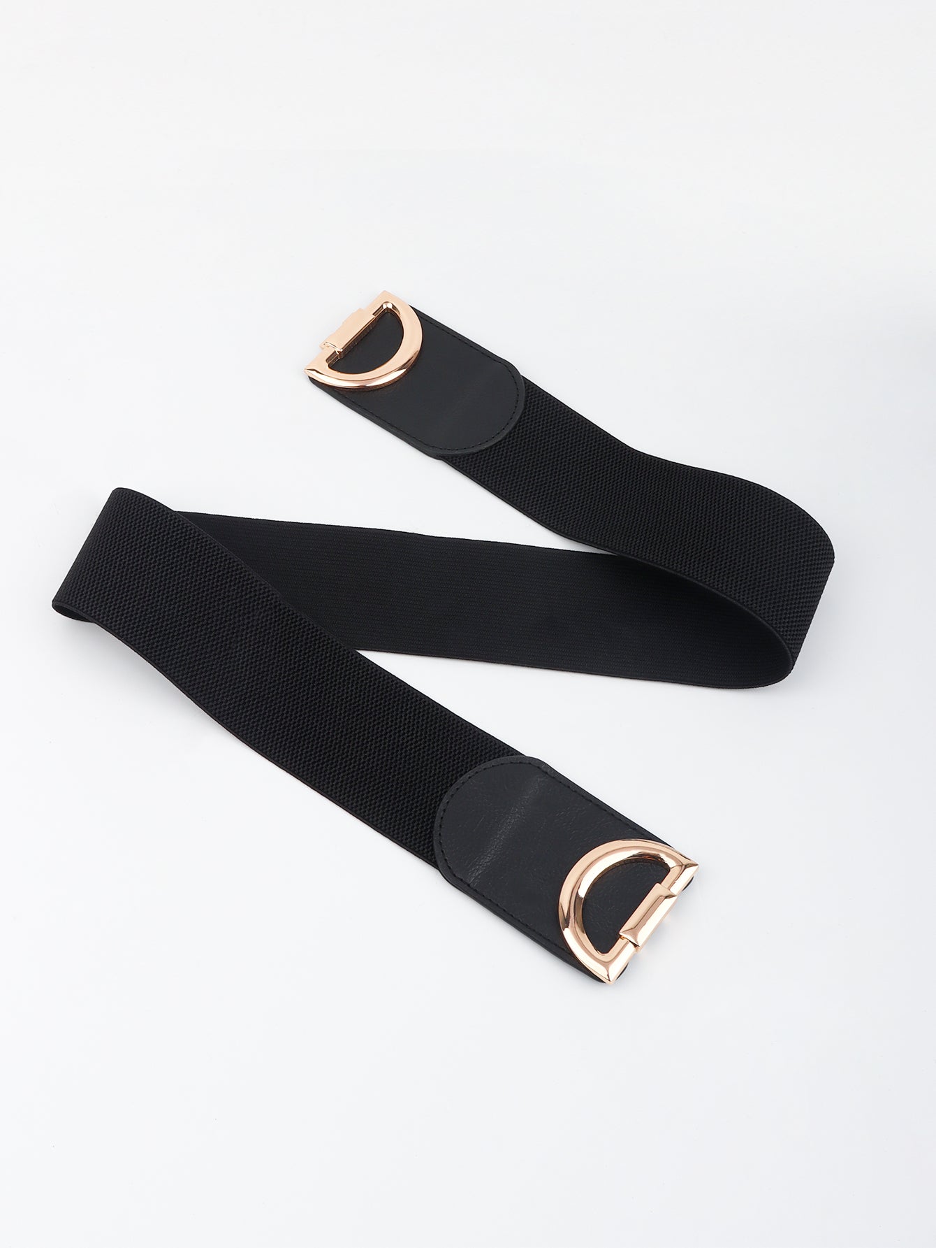 Black belt with rose gold buckle on a white background