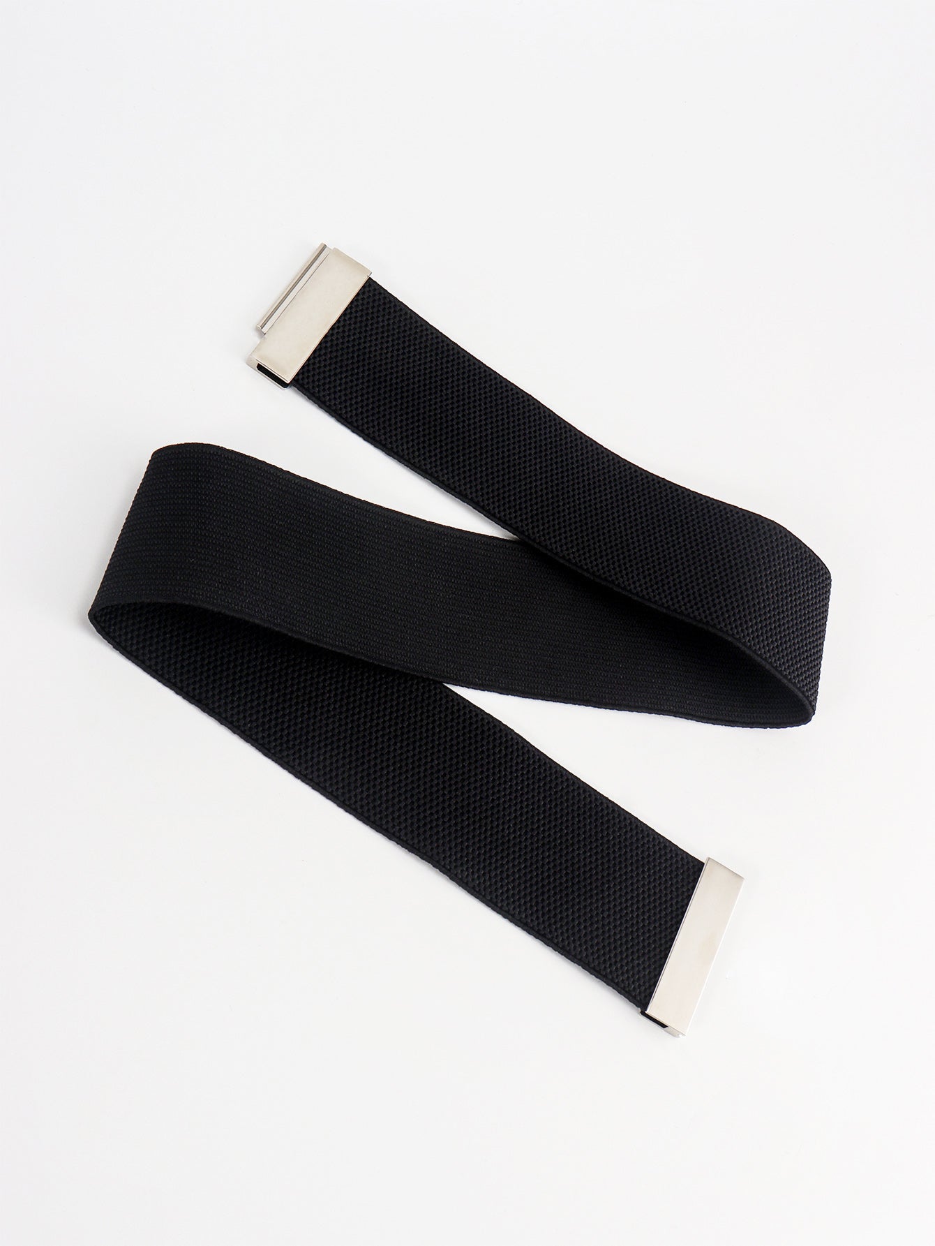 Black belt with silver buckle on a white background