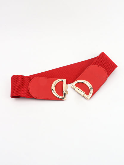 Red belt with gold D-ring buckle on a white background