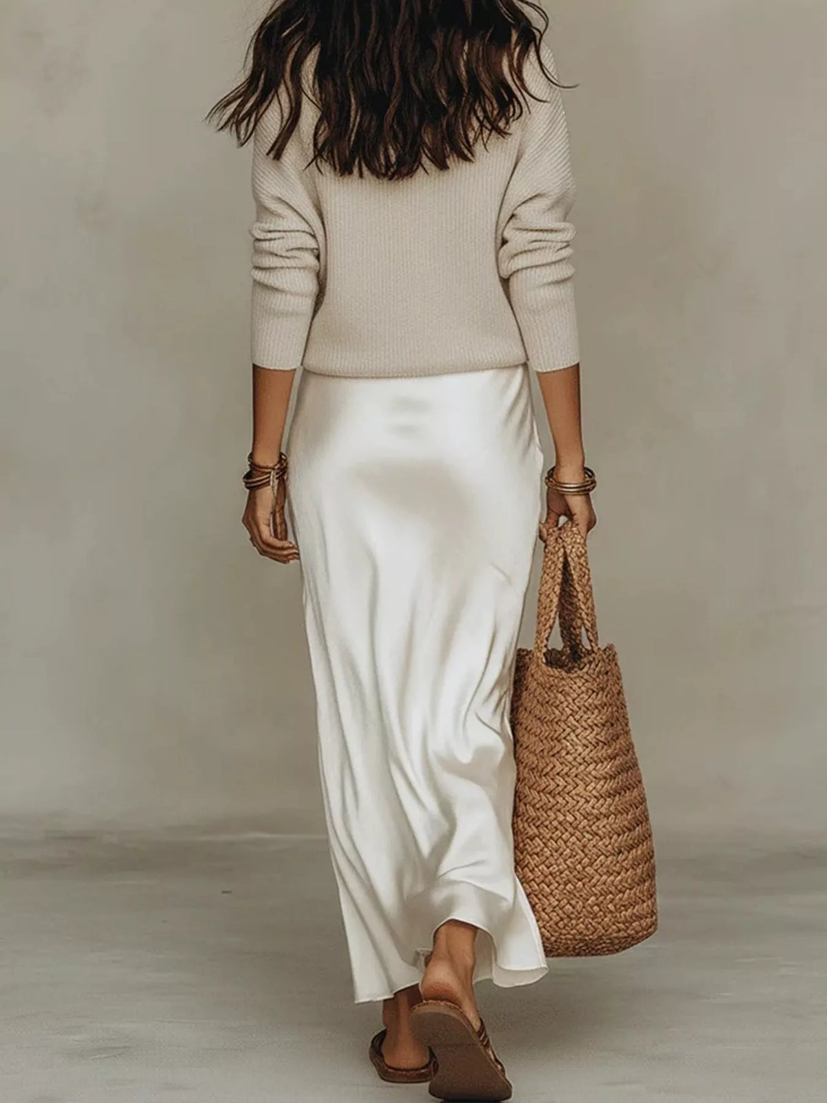 Back view of apricot ribbed top and ivory satin midi skirt.