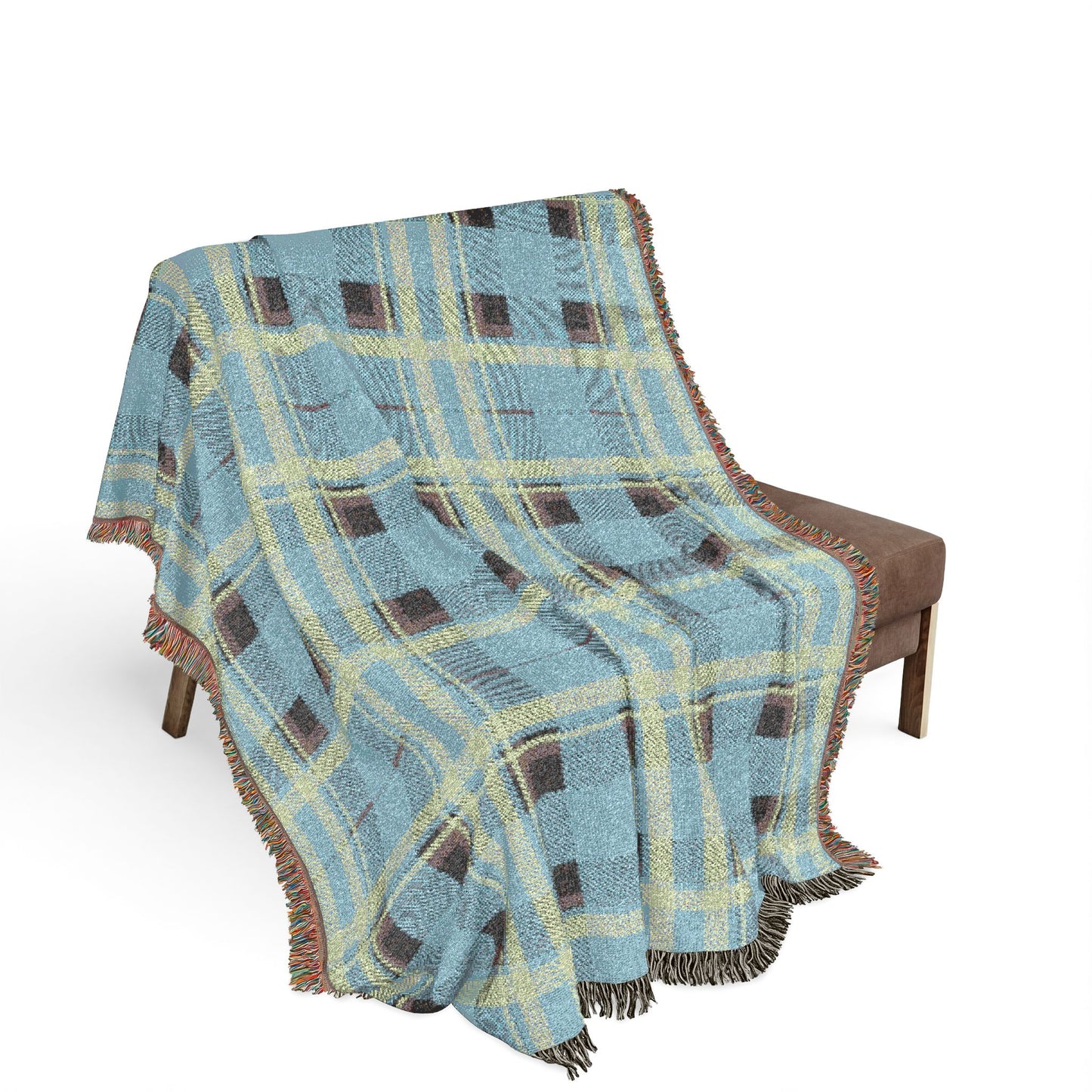 Plaid blanket draped over a chair on a white background