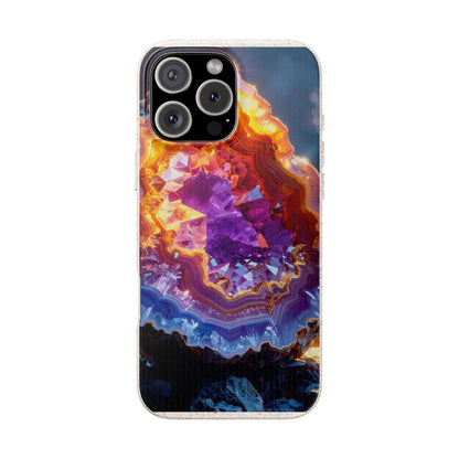A clear iPhone case featuring a vibrant, detailed graphic print of a geode with purple, orange, and blue crystals, shown on a white background.