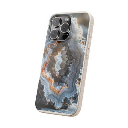 A protective phone case featuring a detailed geode and agate pattern in shades of gray, blue, white, and orange, with a light beige textured border, shown on a plain white background.