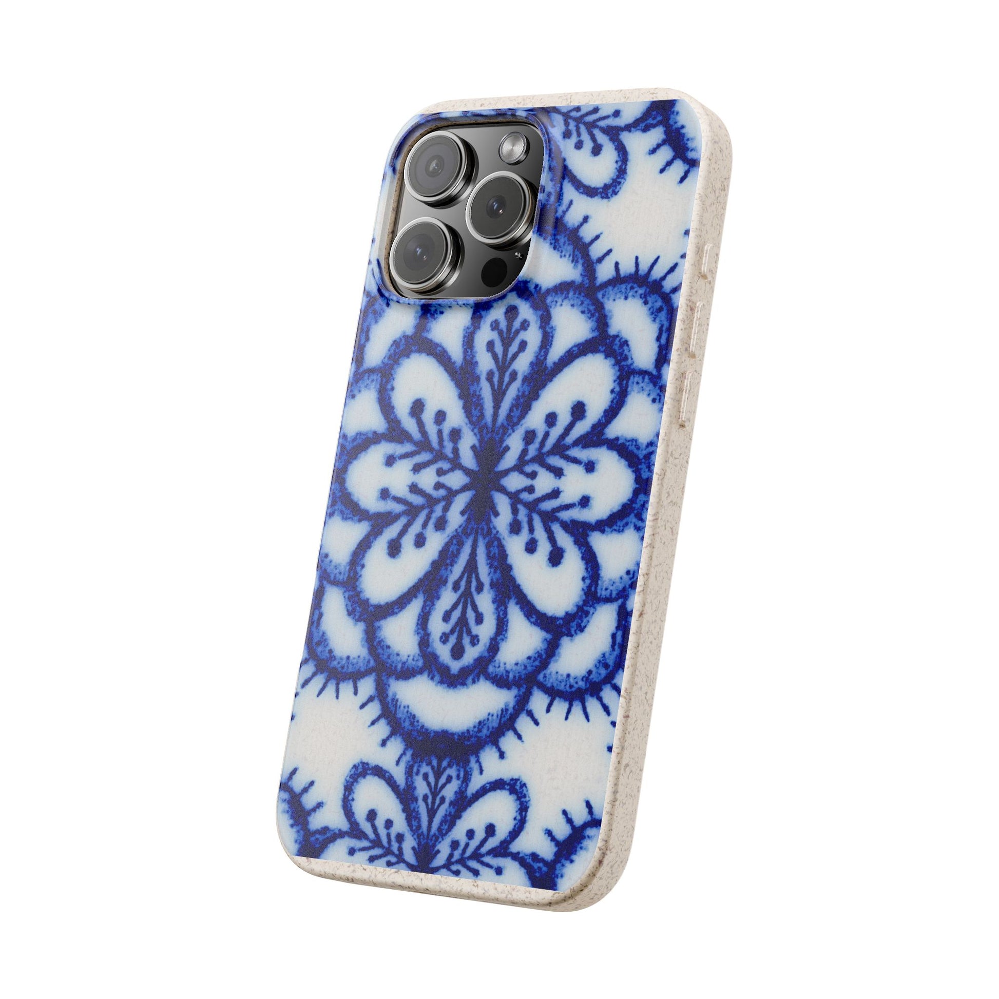 A protective phone case with a blue and white floral mandala pattern, shown on a light-colored smartphone against a plain white background.