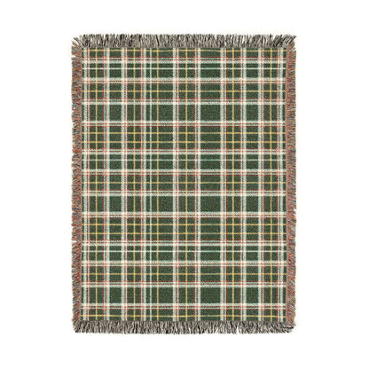 A rectangular woven throw blanket with a green, red, beige, and yellow plaid pattern and fringed edges, shown flat against a white background.