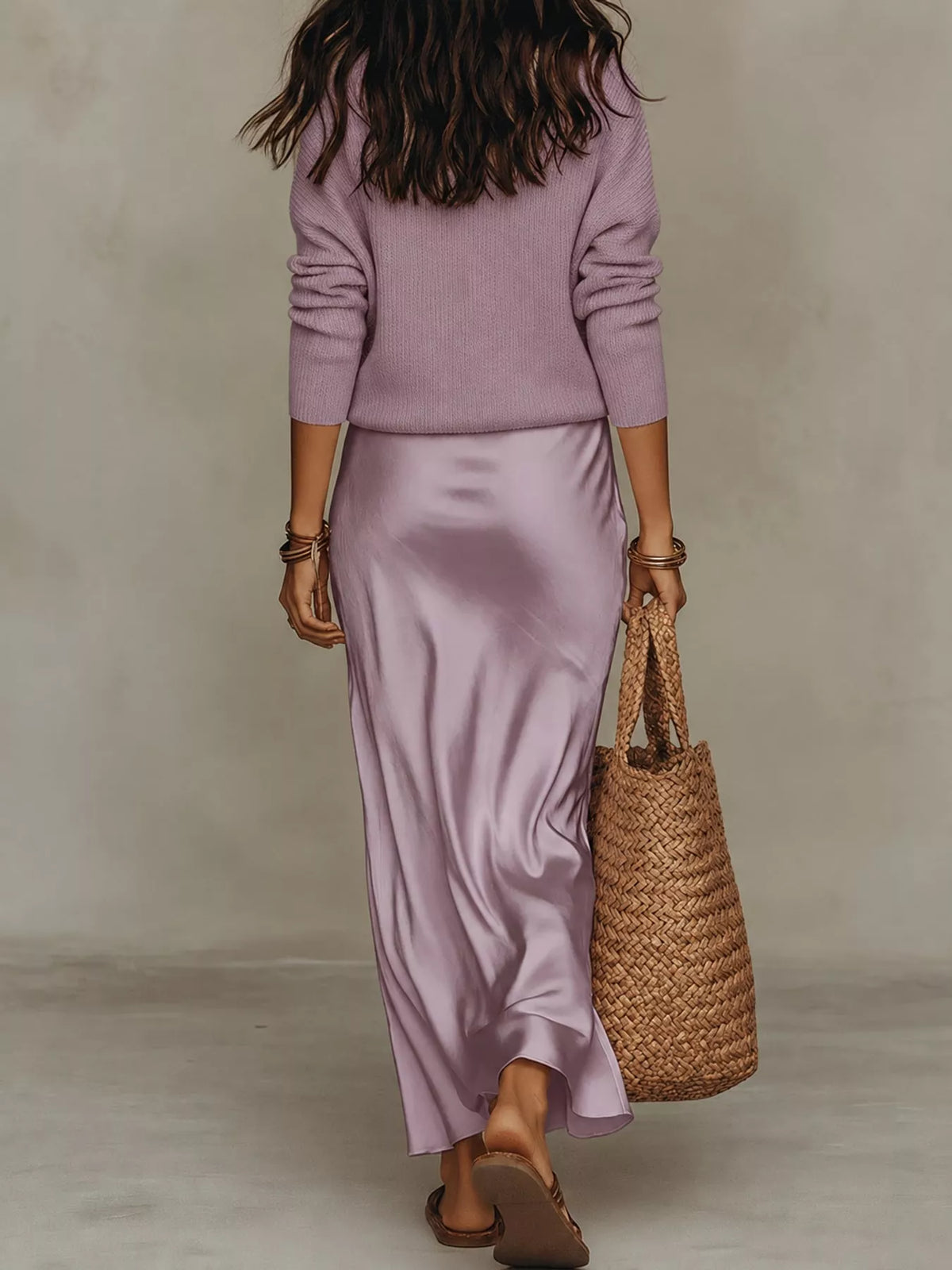 Back view of purple ribbed top and satin midi skirt set.