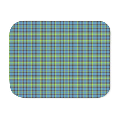 A rectangular mat with rounded corners featuring a blue, green, and gray plaid pattern, shown on a plain white background.