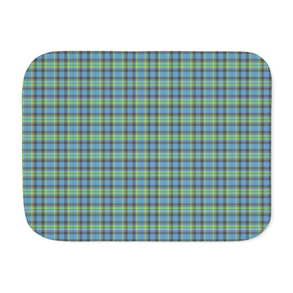 A rectangular mat with rounded corners featuring a blue, green, and gray plaid pattern, shown on a plain white background.