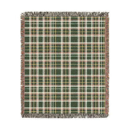 A square woven throw blanket with a green, red, white, and yellow plaid pattern and fringed edges, shown flat against a white background.