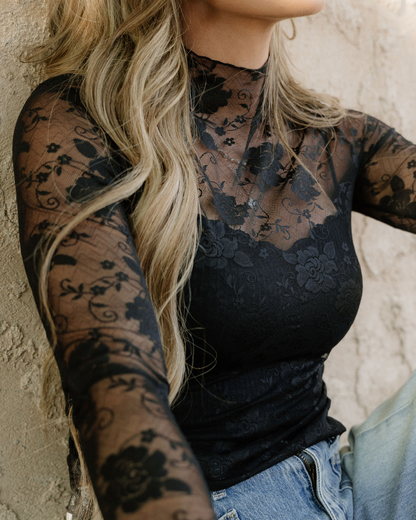 Close up of lace sleeve blouse.