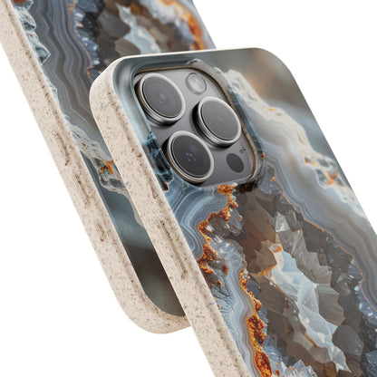 A close-up of a smartphone case with a geode or agate-inspired pattern in gray, white, and brown, with a textured beige bumper edge, shown on a phone against a white background.