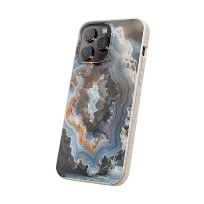 A protective phone case featuring a detailed geode and agate pattern in shades of gray, white, and orange, shown on a light gray iPhone against a plain white background.