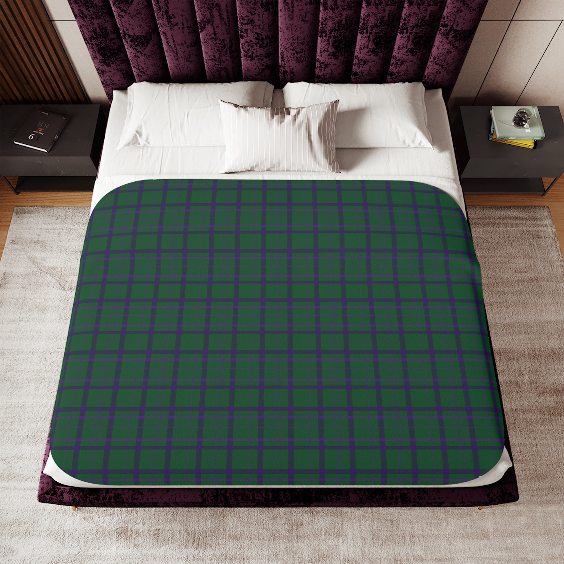 Black blanket with white dog pattern on a bed in a bedroom setting