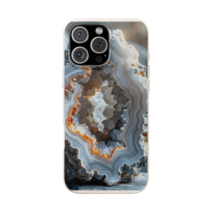 A phone case featuring a detailed geode or agate crystal formation print with gray, white, and orange-brown natural stone patterns, shown on a white background.
