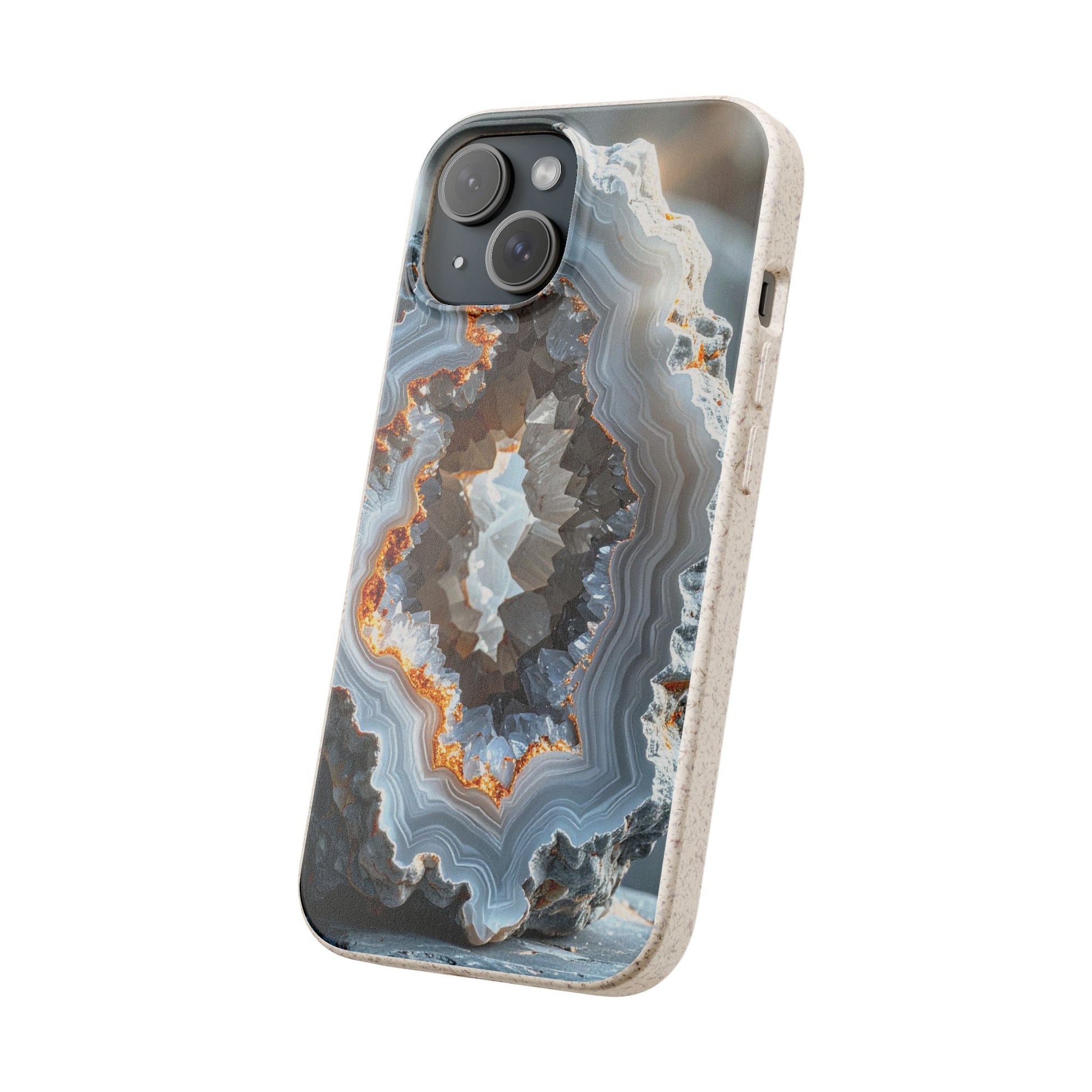 A phone case featuring a realistic geode or agate stone pattern with concentric bands of gray, white, black, and orange, shown on a light wood-textured frame against a plain white background.