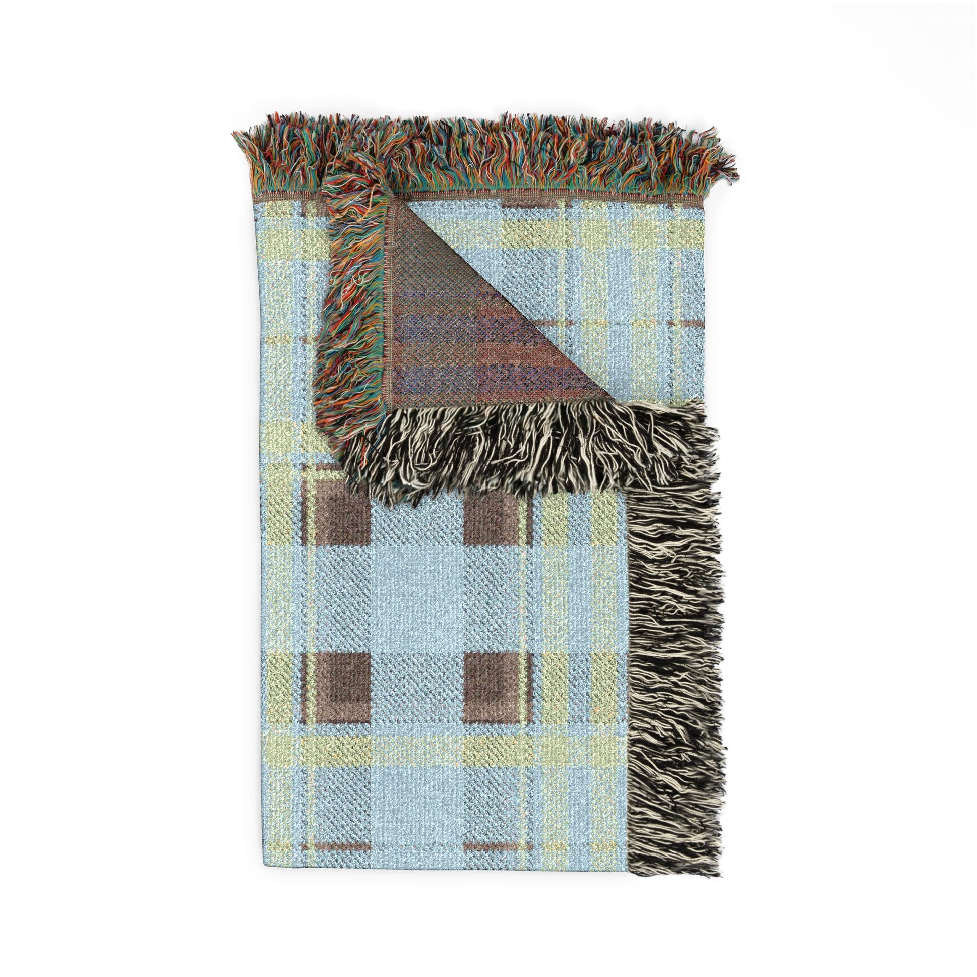 Woven blanket with geometric pattern and fringed edges on a white background