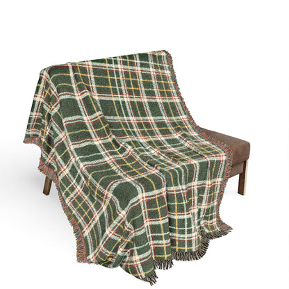 Decorative tapestry with intricate patterns draped over a chair on a white background