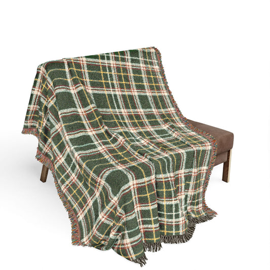 Decorative tapestry with intricate patterns draped over a chair on a white background
