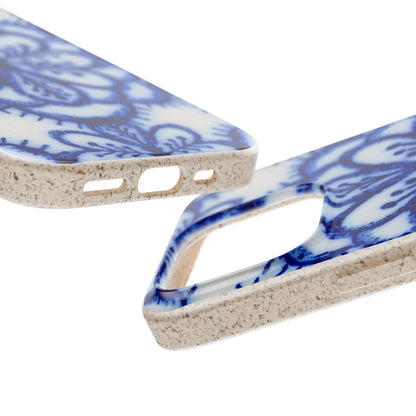 Close-up of a smartphone case with a blue and white floral pattern and a speckled beige textured edge, shown on a white background.