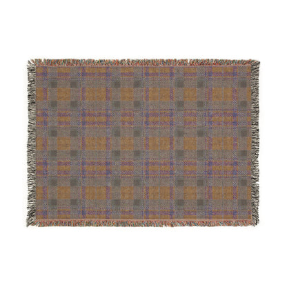 A rectangular woven throw blanket with a plaid pattern in gray, ochre, and blue, featuring fringed edges on all sides, shown against a plain white background.
