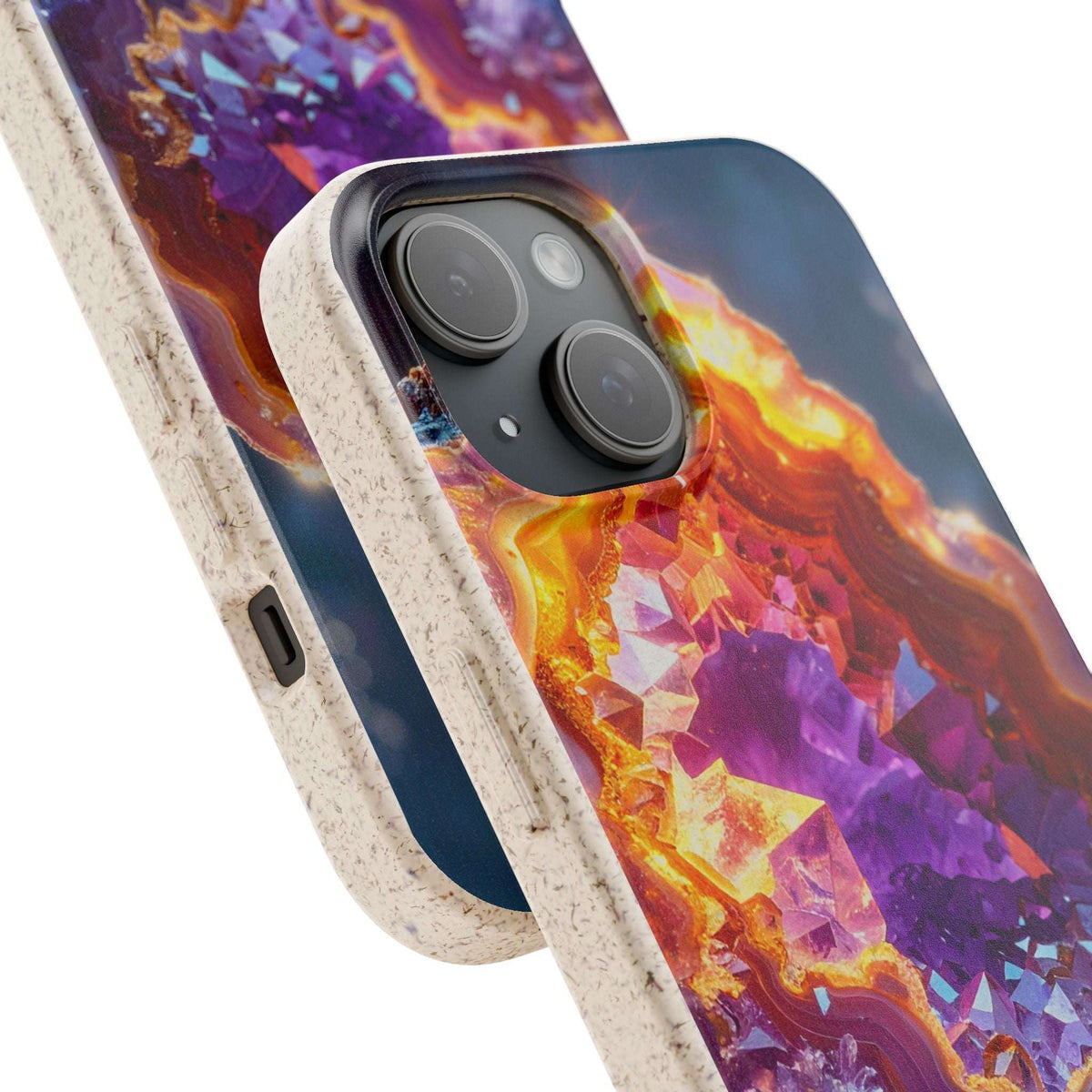 A close-up of a smartphone case shown from the back and side on a white background. The case has a textured light beige border and a vivid printed back design featuring purple, orange, yellow, and blue geode-like crystal patterns.