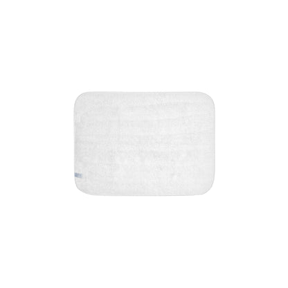 Rectangular white bath mat on a white background