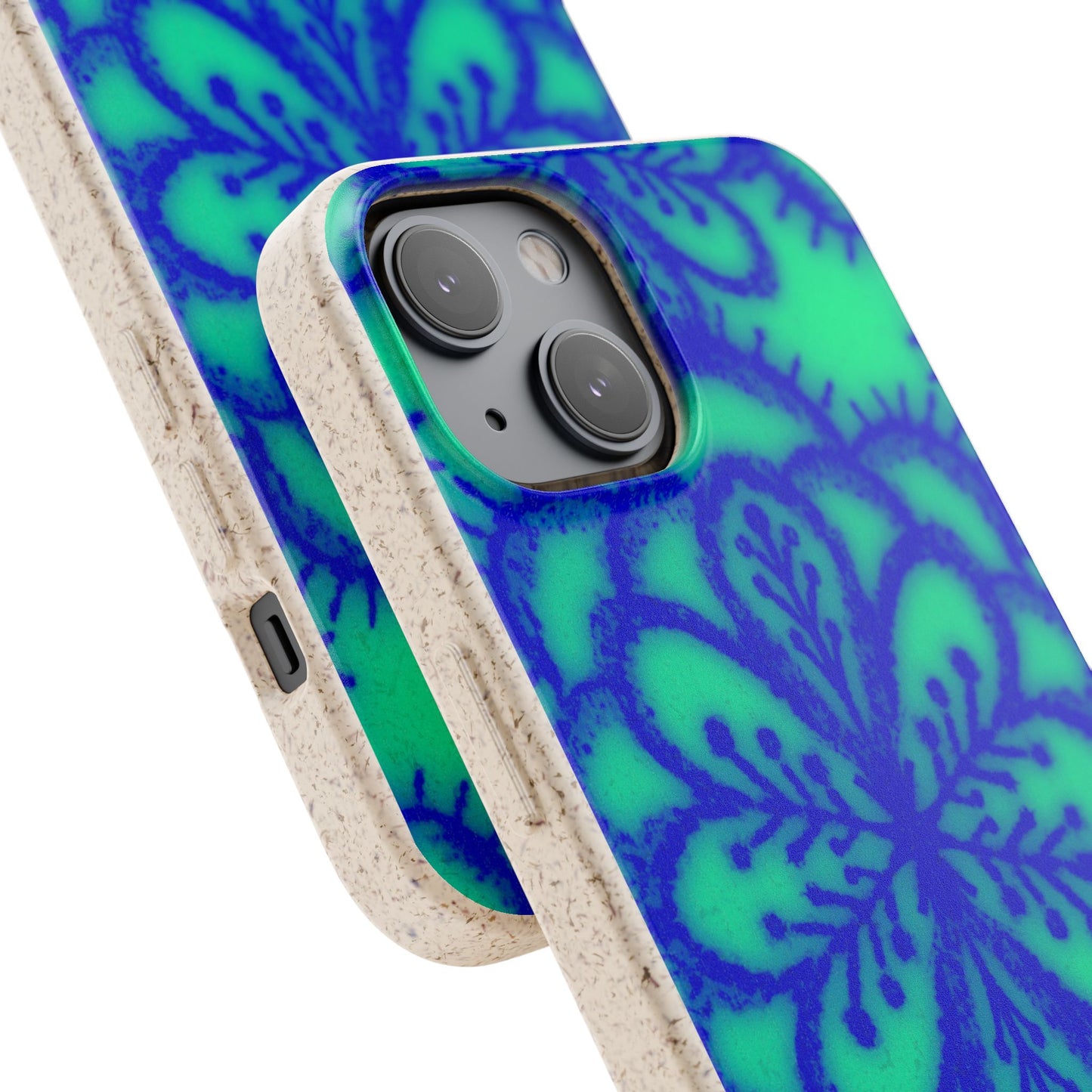 A close-up of a smartphone case with a blue and green floral mandala pattern and a natural beige textured edge, shown on a phone against a white background.