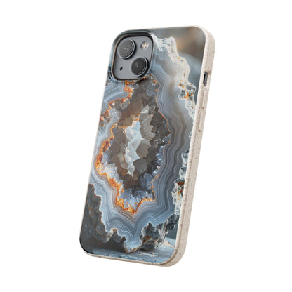 A protective phone case featuring a realistic geode and agate stone pattern with concentric bands of gray, white, and orange, shown on a light-colored smartphone against a plain white background.