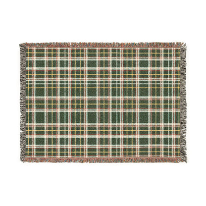 A rectangular woven placemat with a green, white, and yellow plaid pattern and fringed edges, shown flat against a white background.