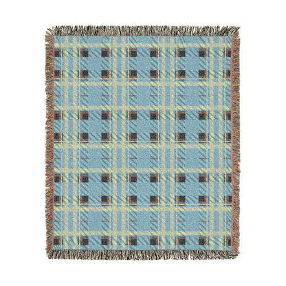 A rectangular woven throw blanket with a light blue, beige, and brown plaid pattern and fringed edges, shown flat against a white background.